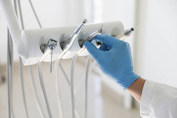 Professional Tooth Extraction technician working in Coral Gables, FL